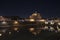 Rome Italy. Beautiful view of Castel Sant`Angelo and the bridge at night with reflections on the Tiber river