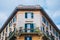 Rome, Italy - A beautifully architectured apartment in downtown Rome during a cloudy afternoon with the classical green windows