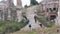 rome, italy - dec 2, 2015: ancient rome roman path going down and up with people near temple of saturn 43 v