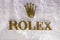 ROME, ITALY - DECEMBER 10, 2020 : Rolex logo on street. Rolex is a manufacturer of high-quality, luxury wristwatches