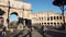 Rome, Italy - December 13th 2020: View of the Arch of Constantine and Coliseum with few tourists