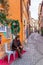 Rome, Italy - December 17, 2019: Elderly senior Italian man in street cafe in historic city