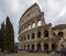 Rome, Italy, January 25th, 2019 - View of the entrance to the Colosseum with tourist waiting to enter under a cloudy sky