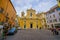 ROME, ITALY - JUNE 13, 2015: Little church at the end of the street in the middle of square, facade in yellow.