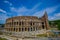 ROME, ITALY - JUNE 13, 2015: Roman Coliseum view in a nice summe day. Building works outside, historic great visit