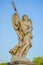 ROME, ITALY - JUNE 13, 2015: Stone sculture in Rome, angel with wings holding a cross