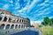 ROME, ITALY - JUNE 2014: Tourists visit Colosseum. The city attracts 15 million people annually