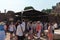 Rome, Italy - large tour group outside the Temple of Julius Caesar in the Roman Forum. Middle aged white tourists in Ancient Rome.