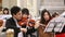 ROME, ITALY - March 25, 2017: Close-up of musician playing classic music on violin. Violinists in the orchestra.