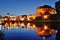 Rome, Italy - Mausoleum of Hadrian and river Tiber at night, on background St. Peter\'s Basilica dome