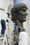 Rome, Italy - October 11, 2018: Restoration of the colossal Constantine bronze statue in Capitoline museum, Rome, Italy