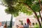 Rome, Italy - A redhead young adult brazilian woman in her 20s looking into the Colosseum taken in a park during the afternoon