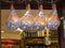 ROME, ITALY- SEPTEMBER 30, 2015: close up of legs of prosciutto hams in the doorway of a delicatessen, rome,