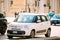 Rome, Italy. White Color Fiat 500L Moving At Rome Street. Five-door, five passenger, front-engine, front-wheel