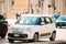Rome, Italy. White Color Fiat 500L Moving At Rome Street. Five-door, five passenger, front-engine, front-wheel drive