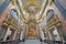Rome - presbyter of baroque church Basilica dei Santi Ambrogio e Carlo al Corso.