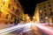Rome road at night, urban traffic light trails and citylife. Italy