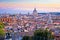 Rome rooftops and landmarks colorful sunset view