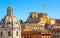 Rome in summer, Italy. Colorful vintage houses with terraces near famous Trajan Forum in Rome center. Scenic view of old beautiful