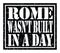 ROME WASN`T BUILT IN A DAY, text written on black stamp sign