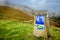 Roncesvalles, Spain - The Way Marking Post with Scallop Shell Symbol and Yellow Arrow Sign in the Pyrenean Mountains on the Trail