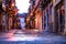 Ronda, Malaga province, Spain - April 03, 2023: Romantic mood of a narrow city street before sunrise