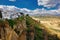 Ronda, Spain - September 06, 2015: Wide angle view of famous Ronda village situated solely on mountaintop against dramatic clouds