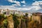 Ronda, Spain - September 06, 2015: Wide angle view of famous Ronda village situated solely on mountaintop against dramatic clouds