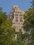 Roof of an apartment tower  peeking over the trees of Central Park, New York