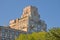 Roof of an apartment towers  peeking over the trees of Central Park, New York