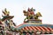 Roof artwork, sculpture of man riding on dragon on Longshan Temple, Taipei, Taiwan