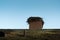 A roof in autumn with an abandoned stork`s nest.