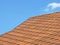 Roof of bituminous tiles taken closeup.