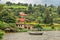 Roof boat anchored at the coast with rwandan village in the background, Kivu lake, Rwanda