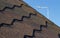Roof, brown tile against the blue sky