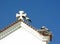 Roof closeup with storks nest at church Matriz de Nossa Senhora do Rosario