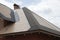 Roof is covered with plywood Boards with a Chimney of brick