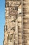 Roof figure of scary gargoyle at main facade of cathedral in Magdeburg during sunset, Germany, closeup, details