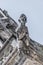 Roof figure of scary gargoyle at main facade of Saint Vitus Cathedral in Prague, Czech Republic, details, closeup