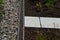 Roof gutter covered with a square plastic green grid. green roofs covered with substrate. the area around the drain is mulched wit