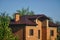 Roof of the house. Trumpet. Wood and roof tiles. Architecture. Texture.