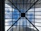 Through the roof, looking straight up through glass atrium roof at skyscrapers.