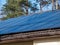 Roof with mounted and installed photovoltaic solar panels on the roof. Rooftop with solar cells for electricity