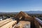 roof of new house, with view of distant mountaires and clear blue skies