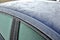The roof of a passenger car froze with heavy flower-shaped icing. Police may fine for poorly cleaned car. there must be no snow or
