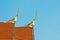 The roof of Prathat Cho Hae Temple with golden Gable Apex on the top in Phrae province, Thailand.