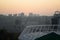 Roof of stadium and cityscape behind on city background. Soccer stadium