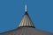 Roof top cone against a blue sky.