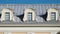 Roof with windows. attic of the house with the sky