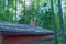 The roof of a wooden dugout with a brick chimney